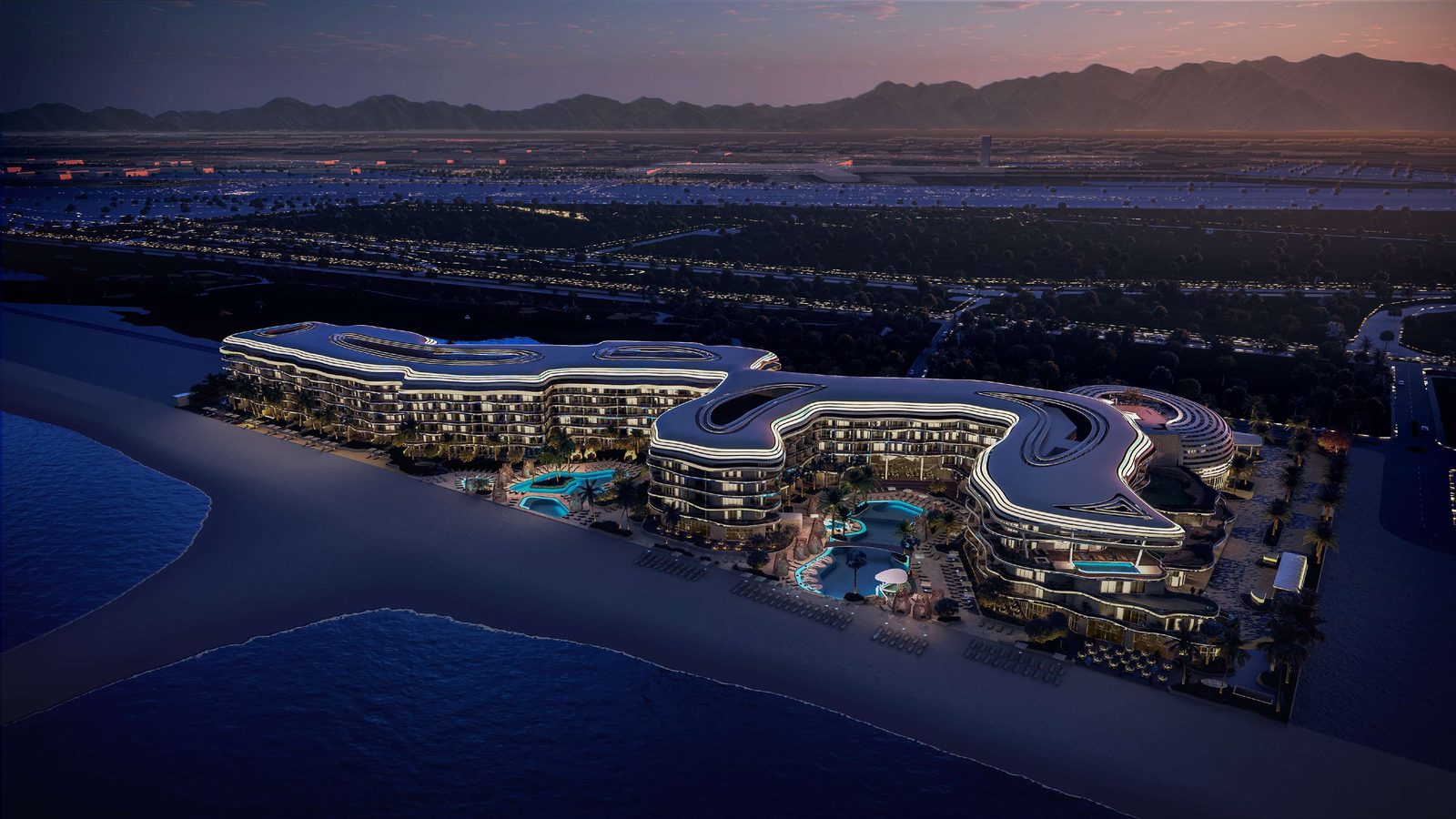 St. Regis Al Mouj Muscat — evening view of the complex