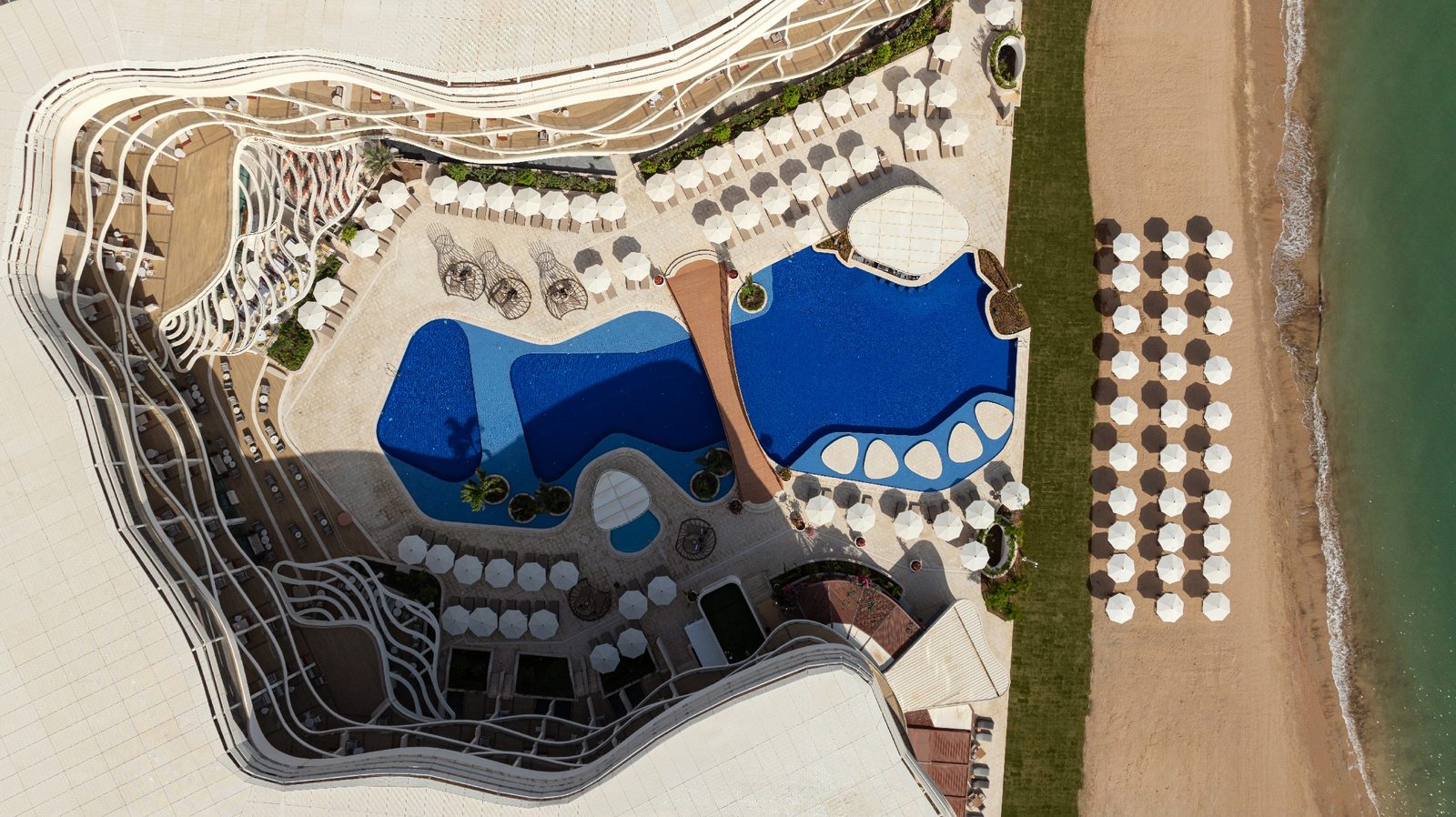 St. Regis Al Mouj Muscat — swimming pools from above