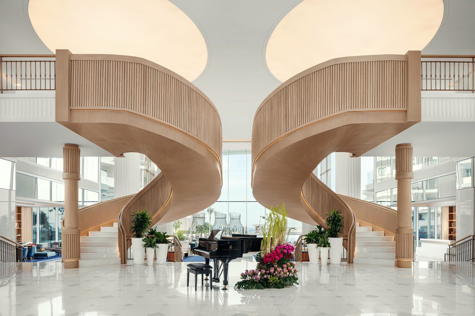 St. Regis Al Mouj Muscat — lobby with sculptural staircases