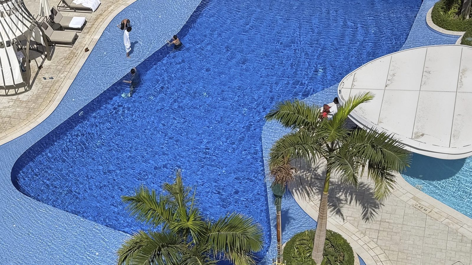 St. Regis Al Mouj Muscat — pool and palms